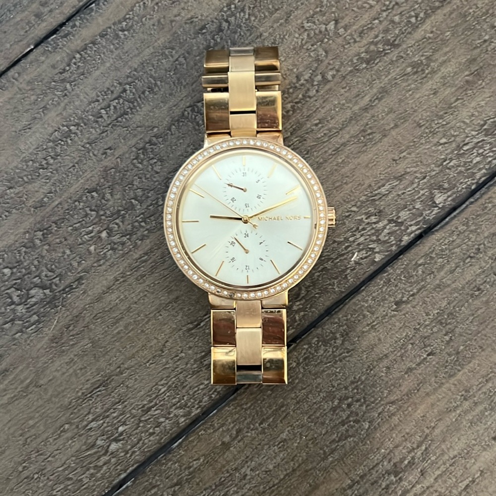Gold Michael Kors women’s oversized watch with diamond bezel